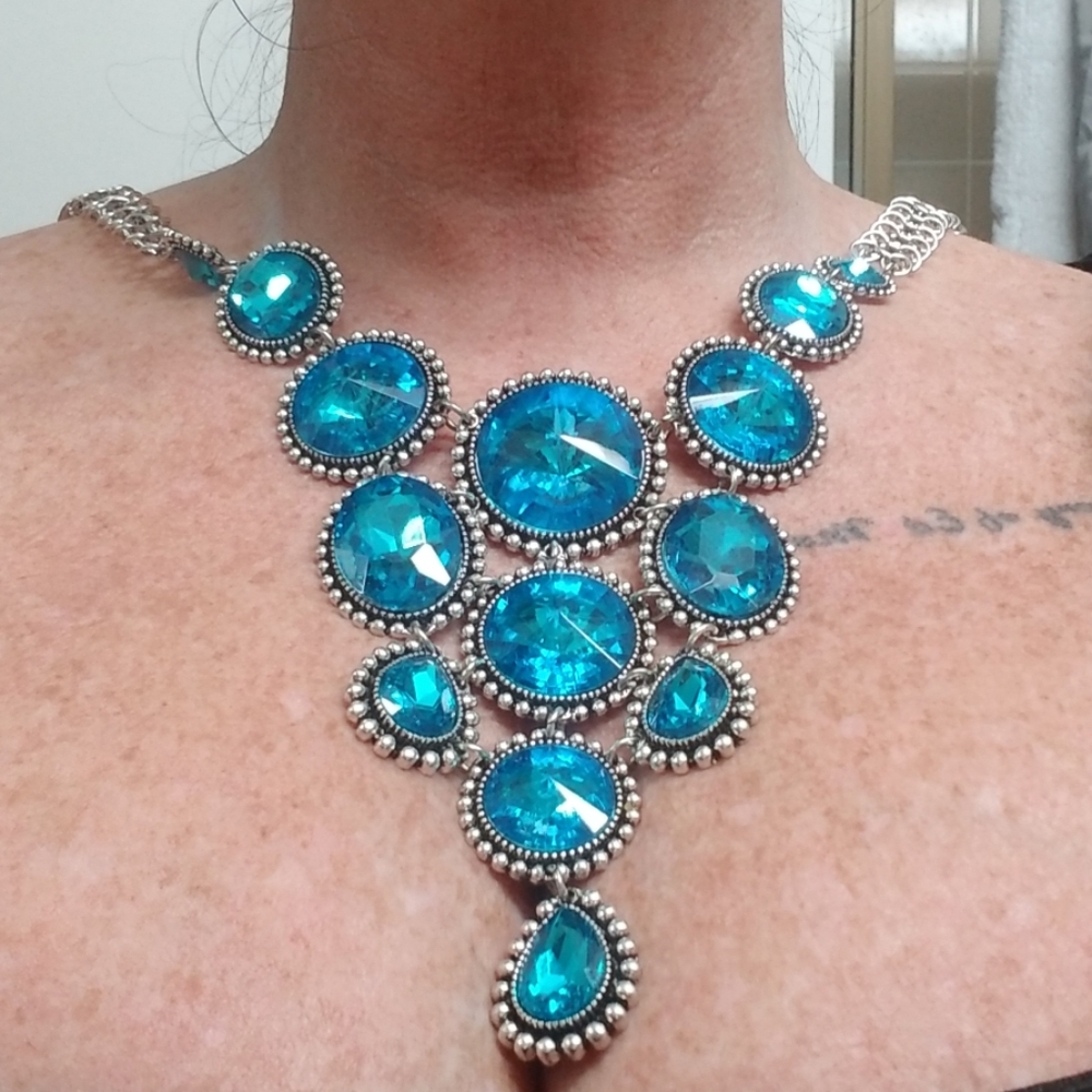 Silver and teal/blue stone necklace.
